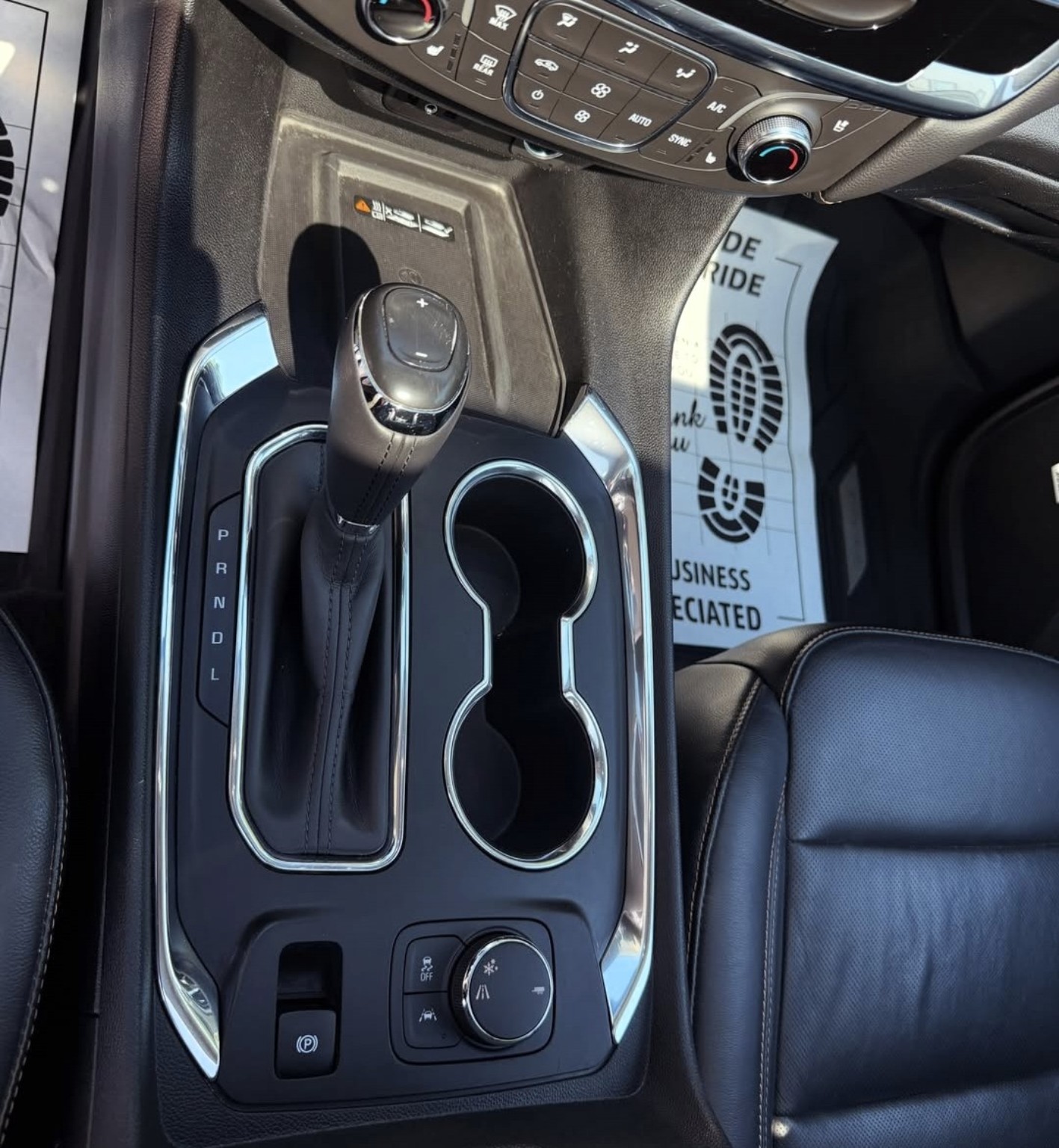 Chevrolet center console after detailing, with clean cup holders and trim