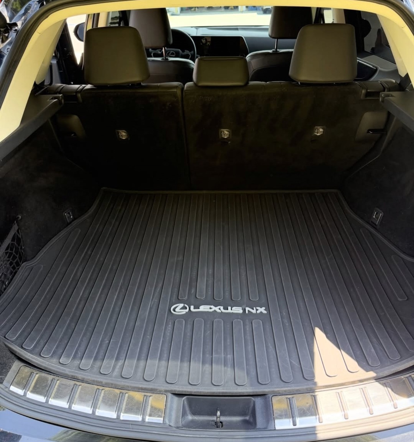 Lexus NX cargo area after cleaning, with a clean cargo mat